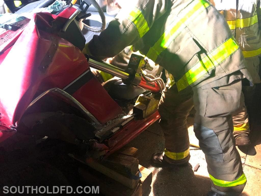 Firefighter-1 graduates practice extrication skills